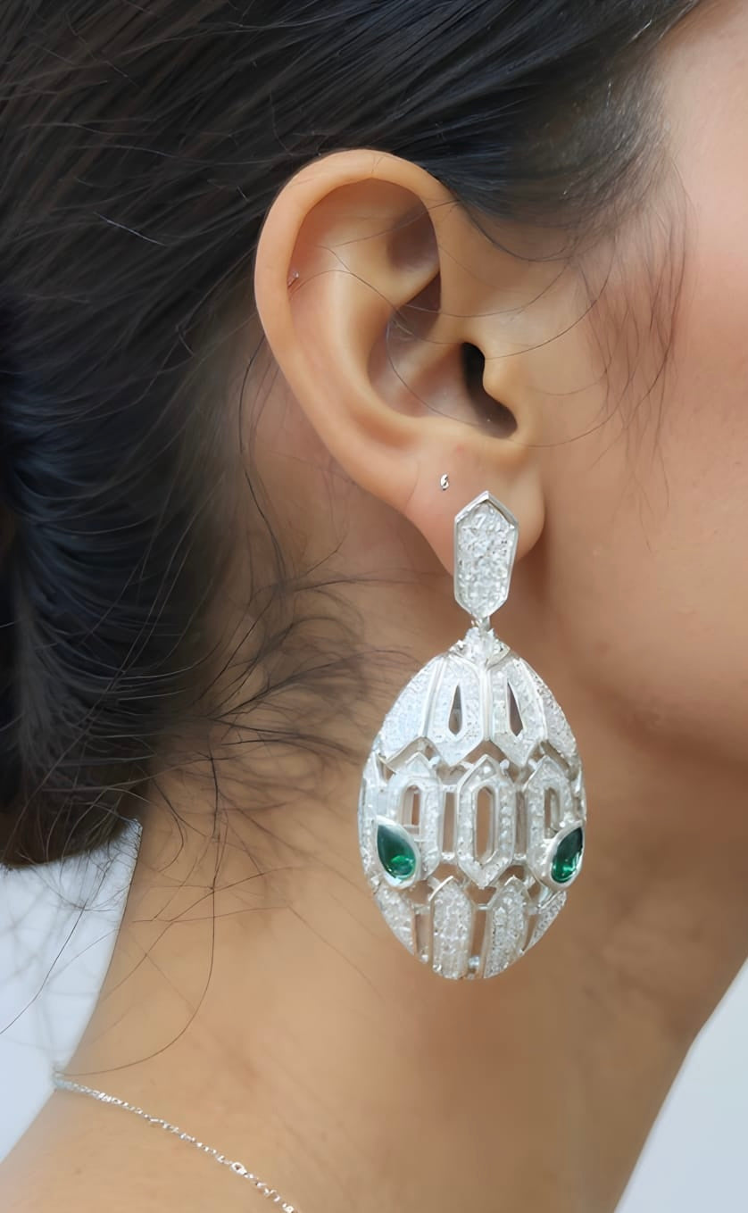 Serpent big crystal earrings with snake motif design