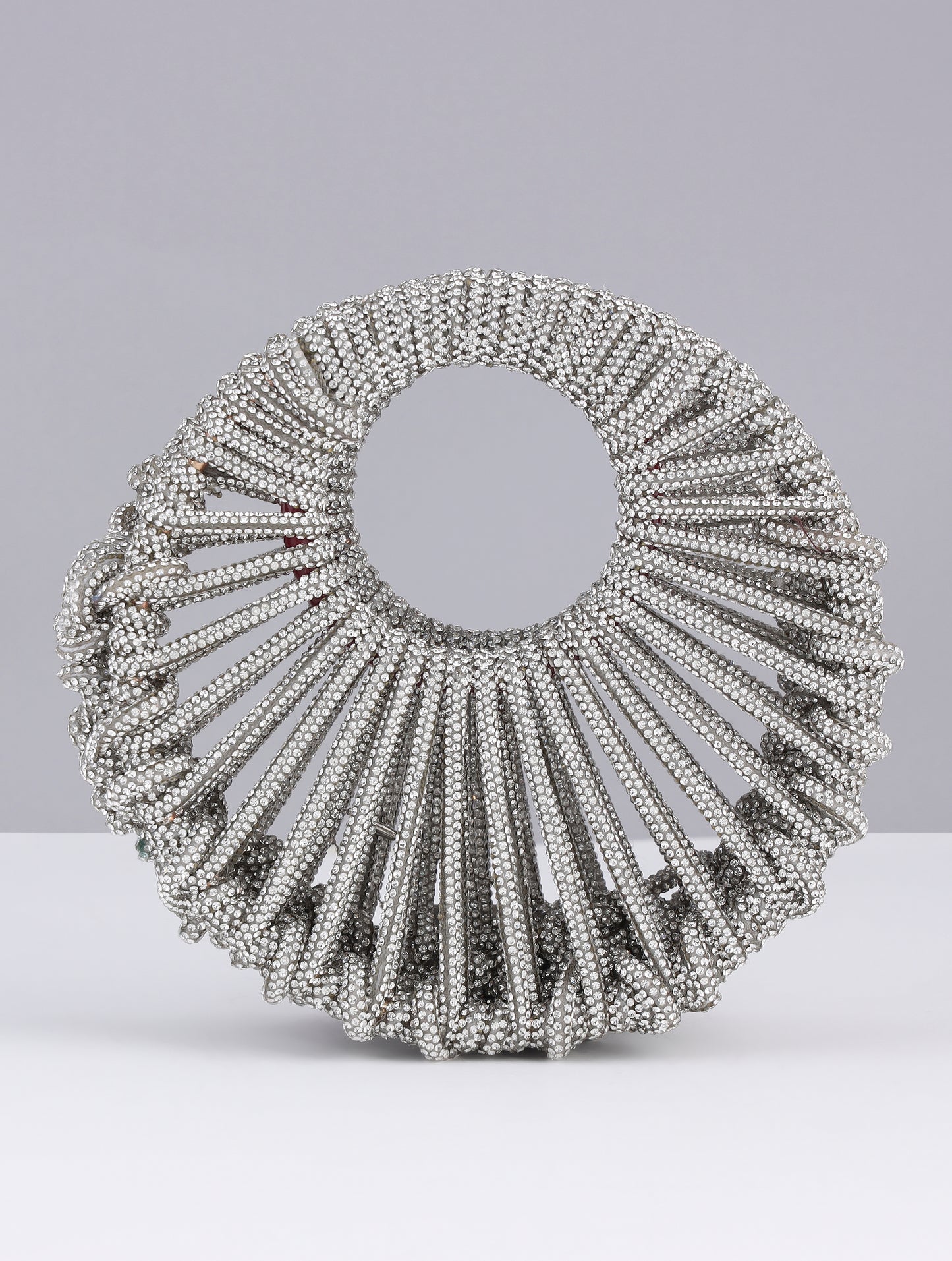 KRITIKA KHURANA THE BOHO GIRL CARRYING MODARTA SILVER CRESCENT CLUTCH