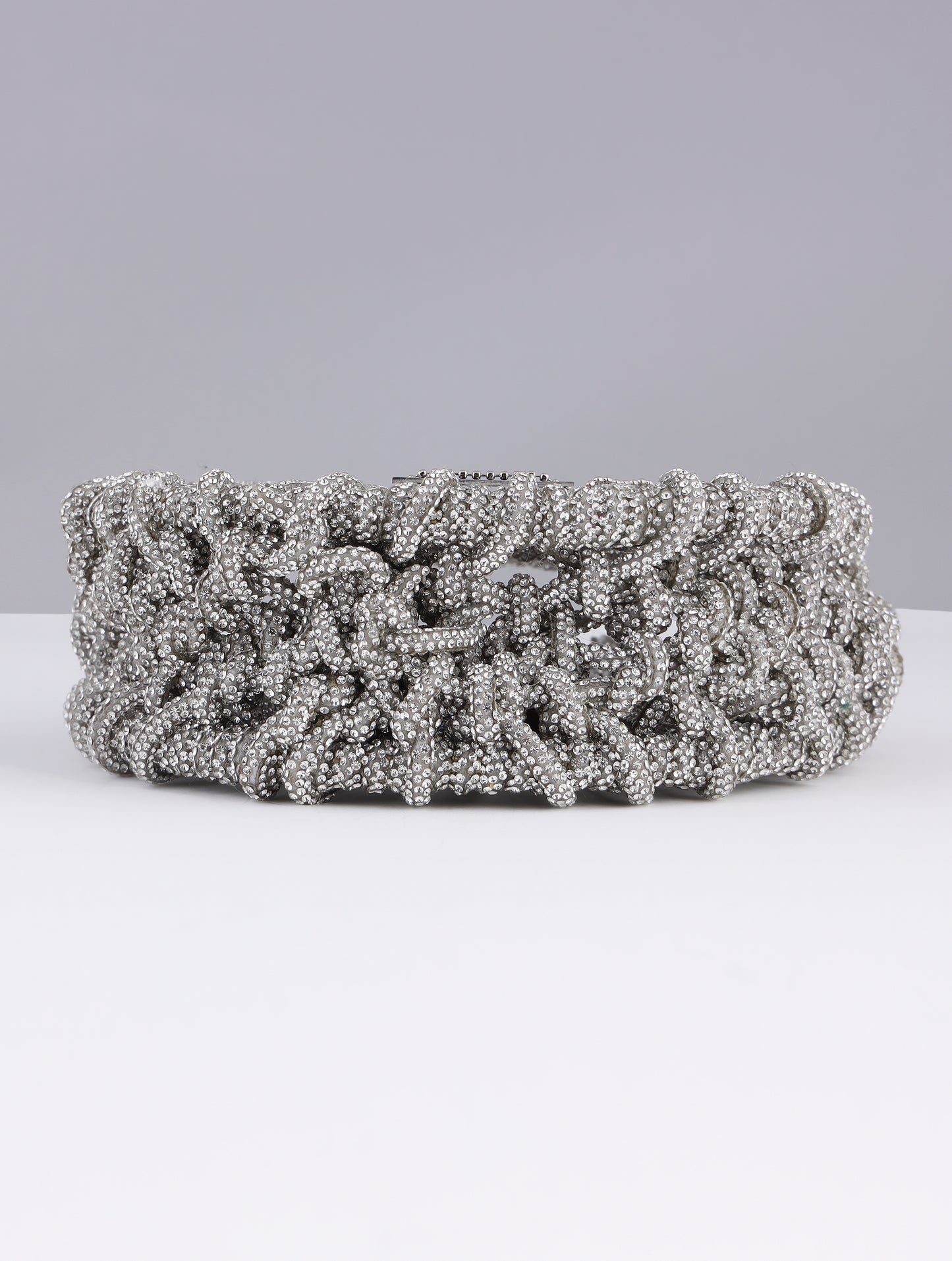KRITIKA KHURANA THE BOHO GIRL CARRYING MODARTA SILVER CRESCENT CLUTCH