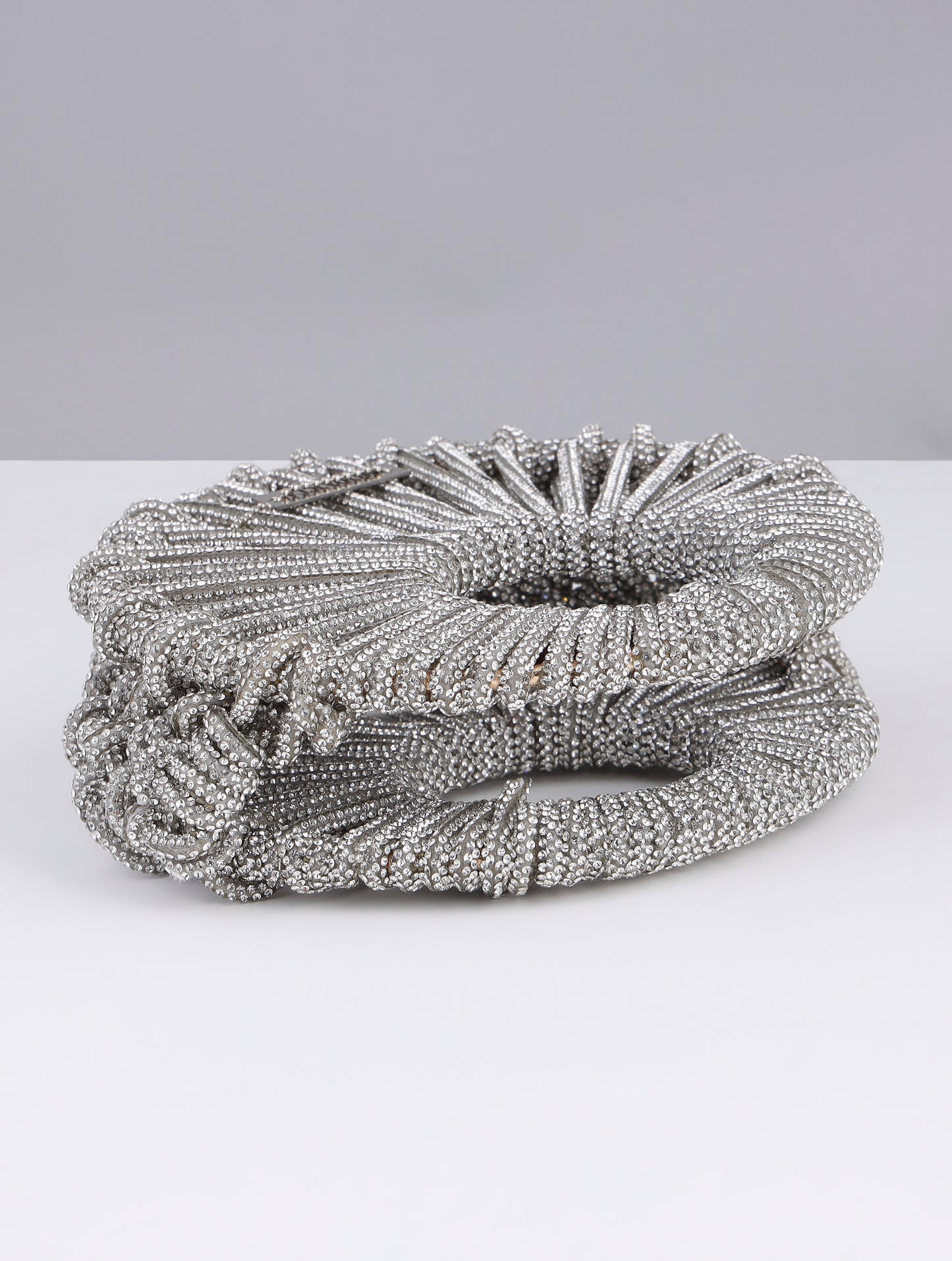 KRITIKA KHURANA THE BOHO GIRL CARRYING MODARTA SILVER CRESCENT CLUTCH