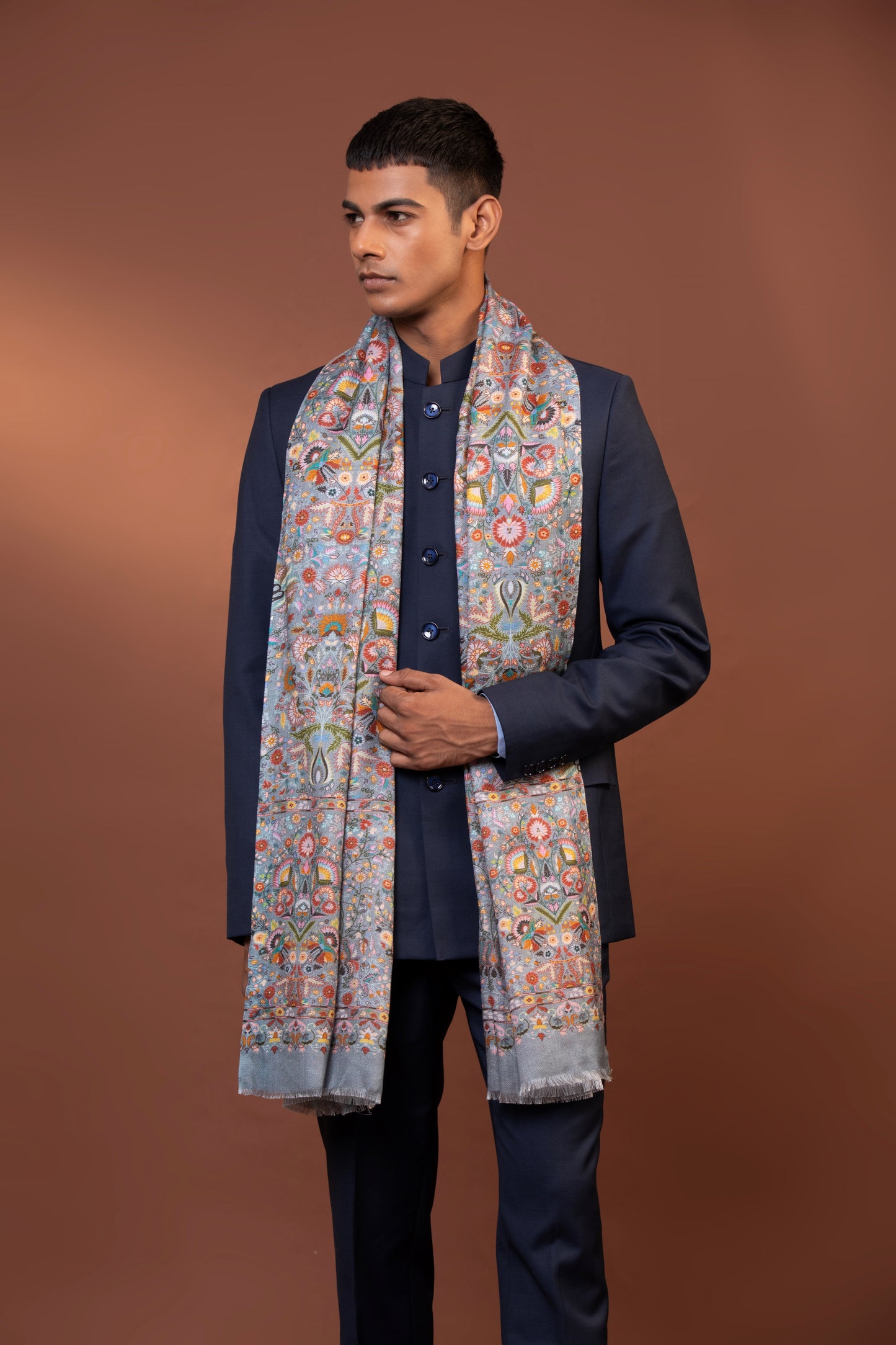 Multicolor print shawl draped over festive attire