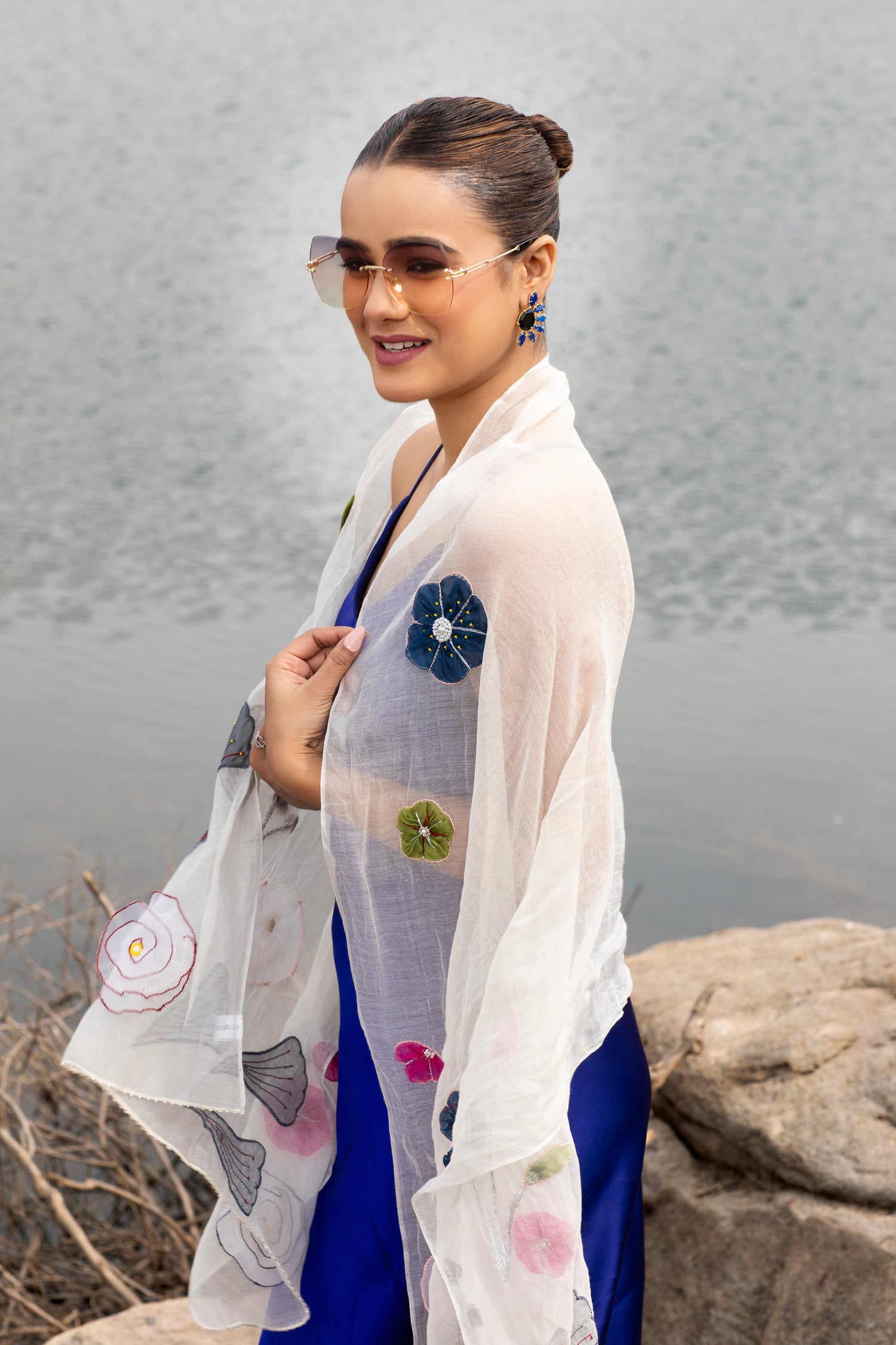 Wrap yourself in elegance with our White Silk Floral Embroidered Cotton Scarf, a versatile and lightweight accessory. Perfect for women seeking both style and comfort in a beautiful head scarf.