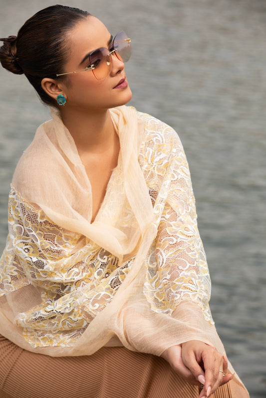 Indulge in sophistication with our designer beige wool scarf, perfect for ladies seeking style and warmth. This exquisite stole boasts intricate details, ideal for adding a touch of luxury to any outfit.