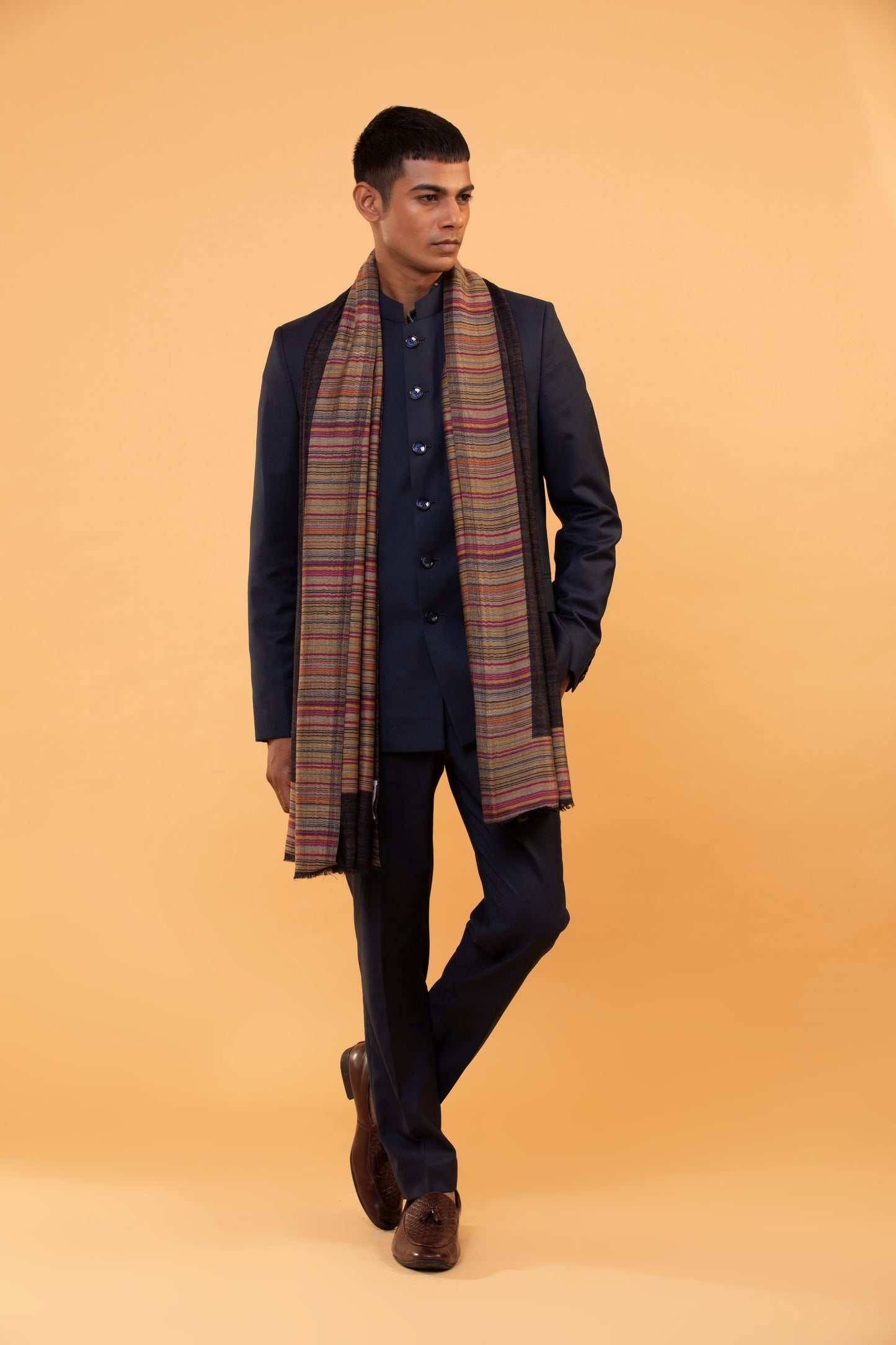 Man draped in ethnic black wool shawl outdoors
