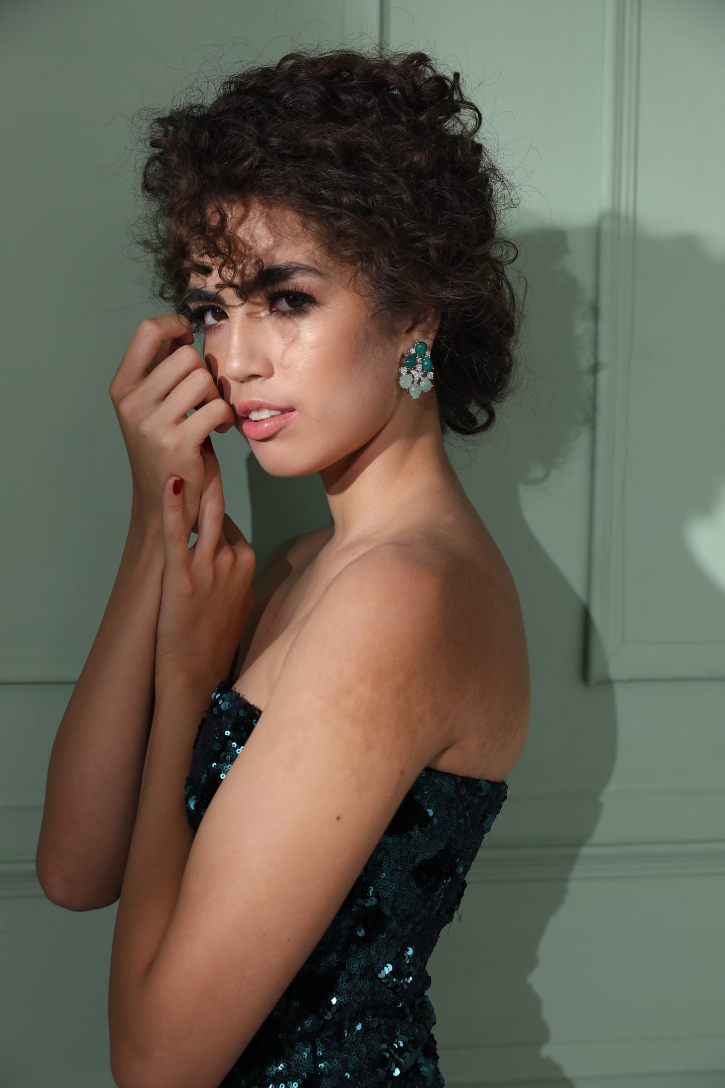 "Fashion Statement Earrings: Make a statement with these unique dual-tone green emerald earrings." "Elegant and Sophisticated Design: Perfect for any occasion, these earrings exude style and class.