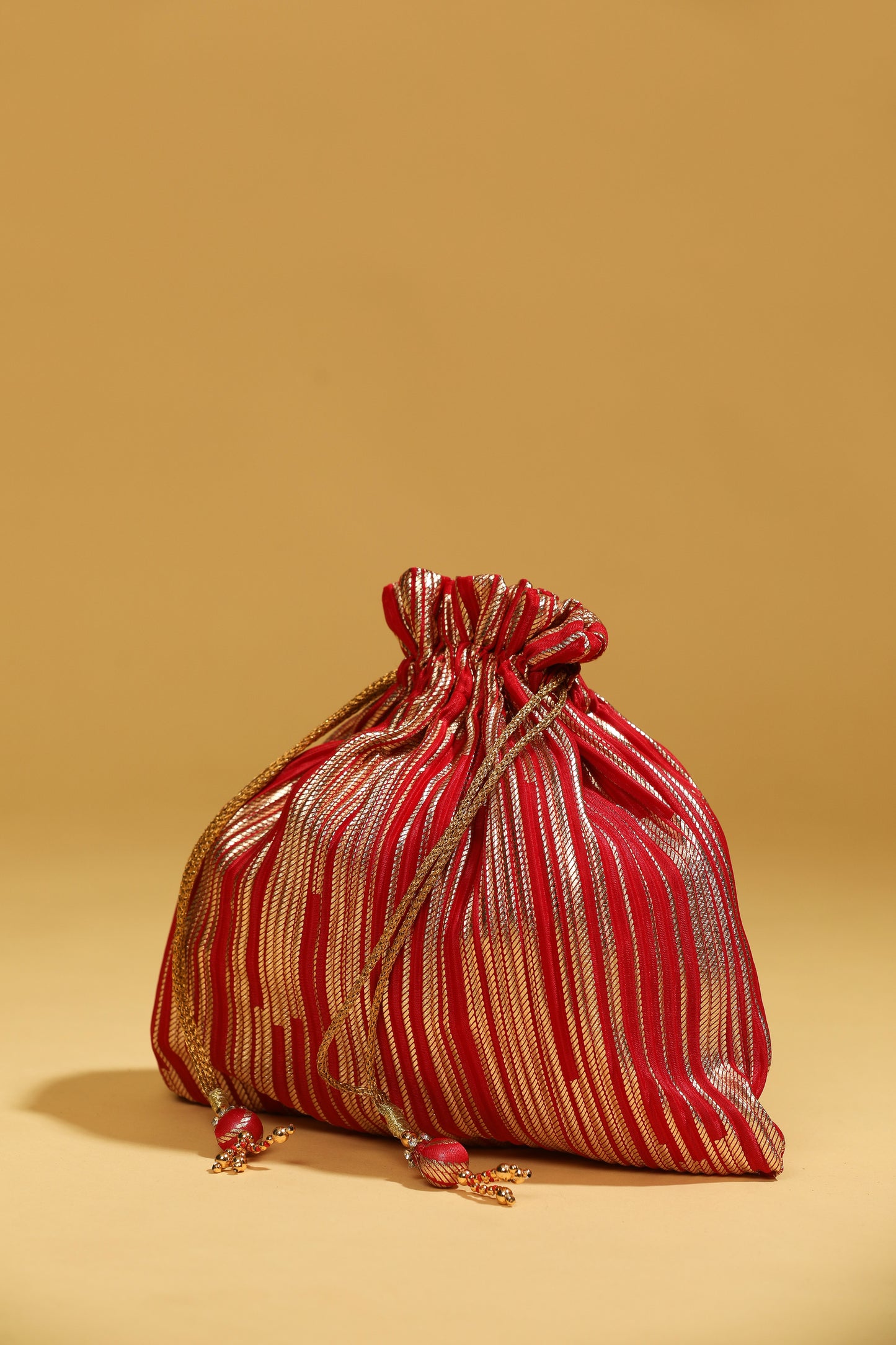 red bead work potli bag, sequin potli bag, long tassel potli, red ethnic bag, glorious tower red potli bag