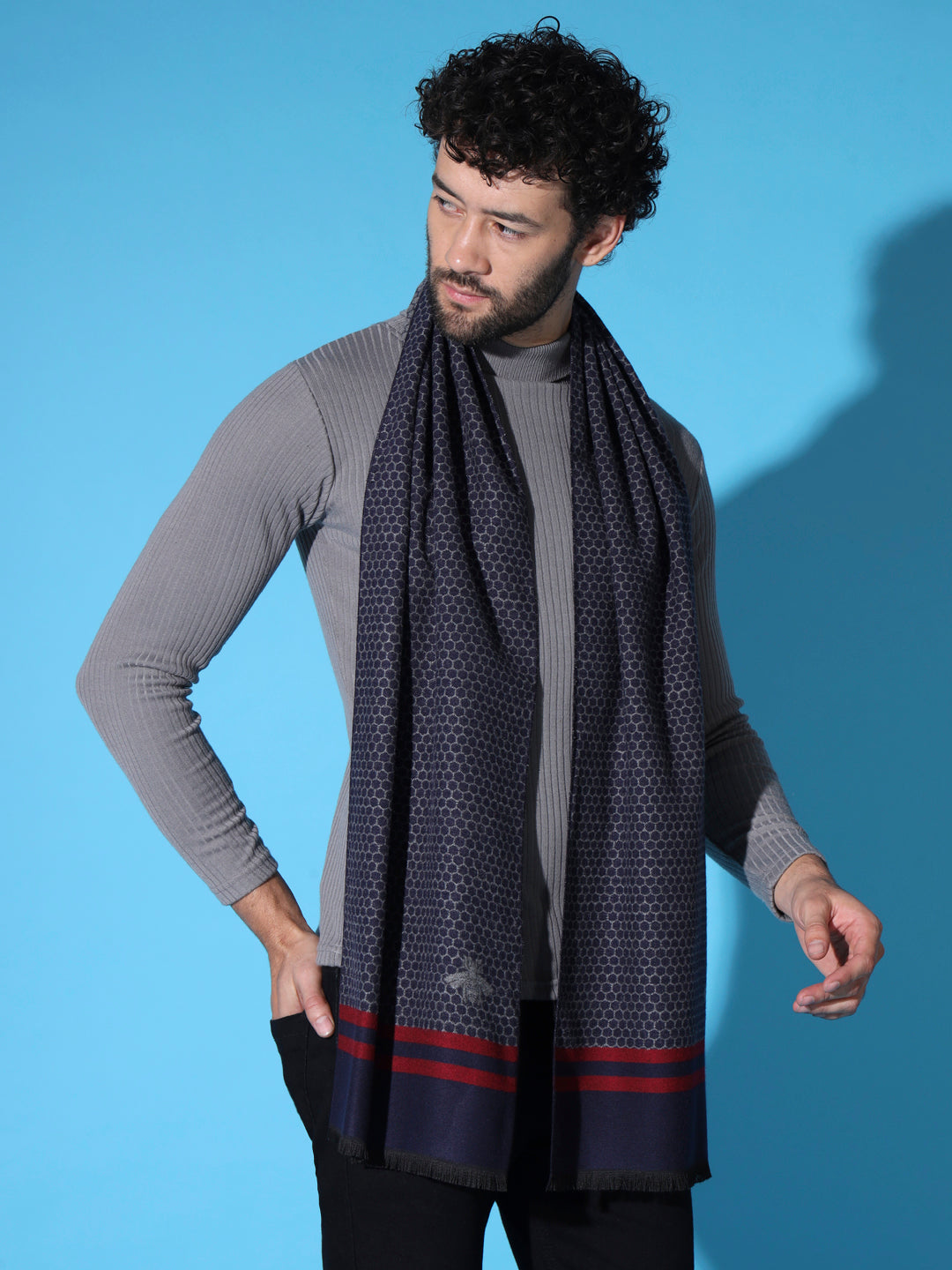 Man styling butterfly weave muffler in winter outfit