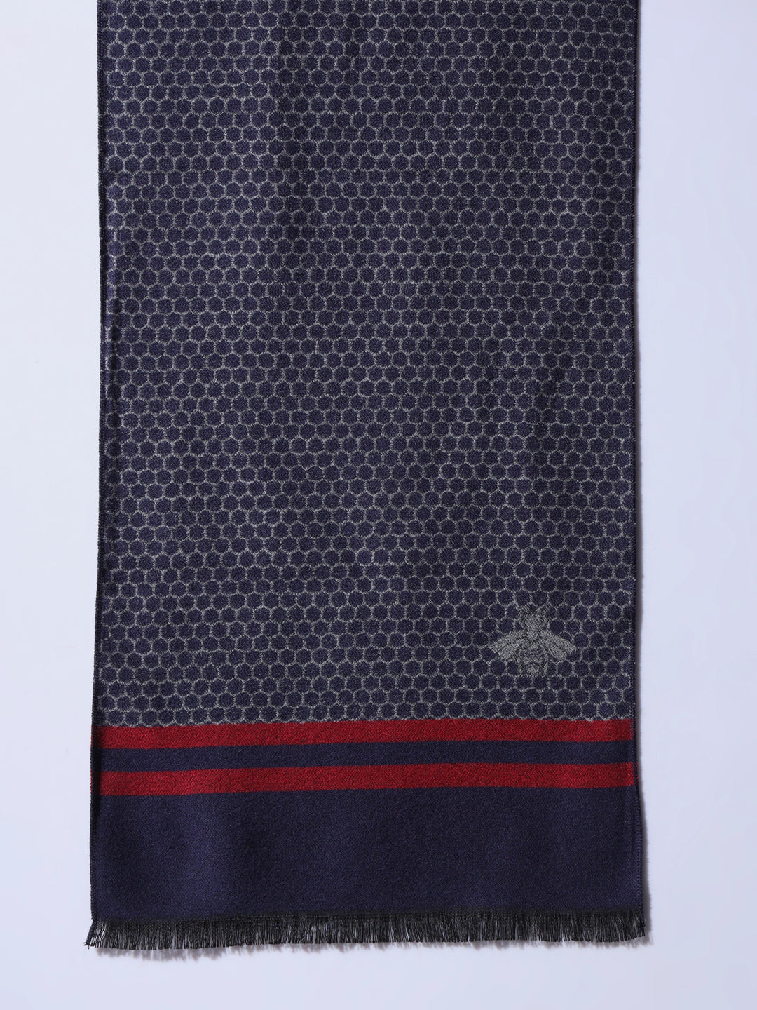 Close-up of butterfly pattern on woolen muffler
