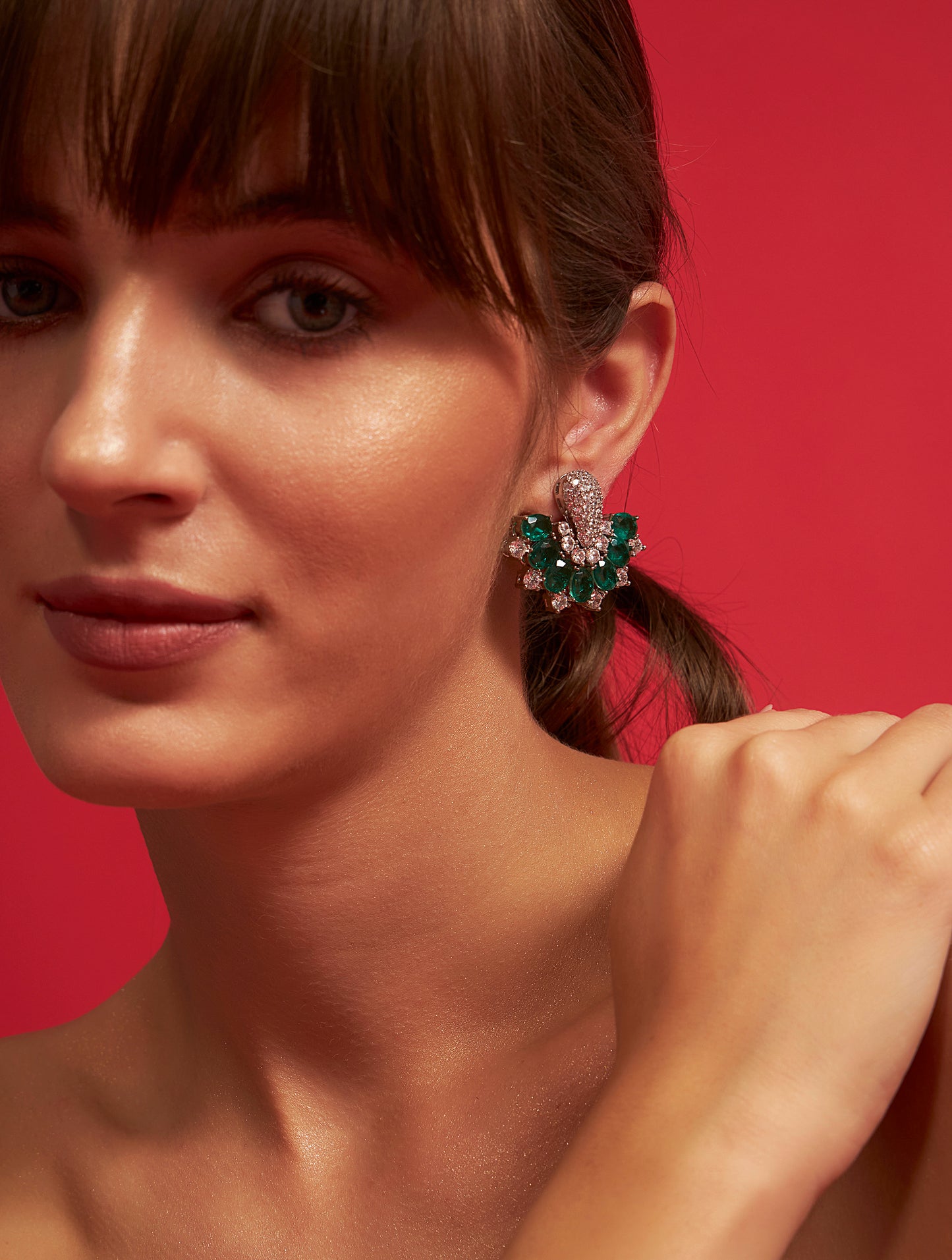 Premium emerald and silver crystal designer studs fashion accessory closeup