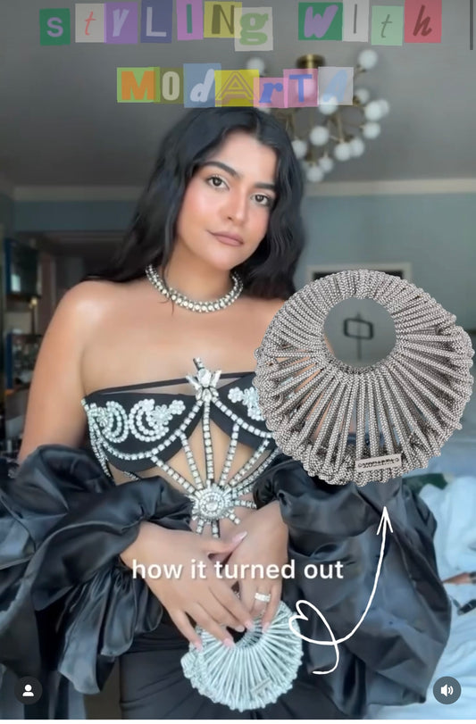KRITIKA KHURANA THE BOHO GIRL CARRYING MODARTA SILVER CRESCENT CLUTCH