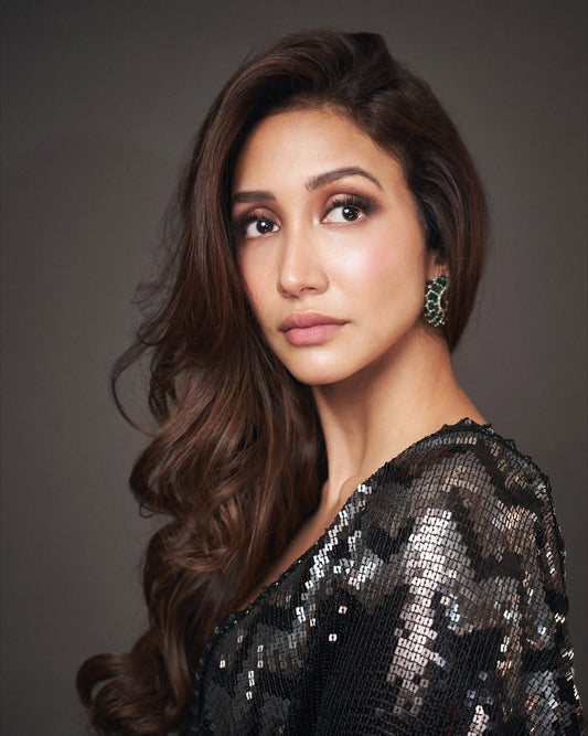 Shreya Chaudhry wearing Modarta emerald loop earrings