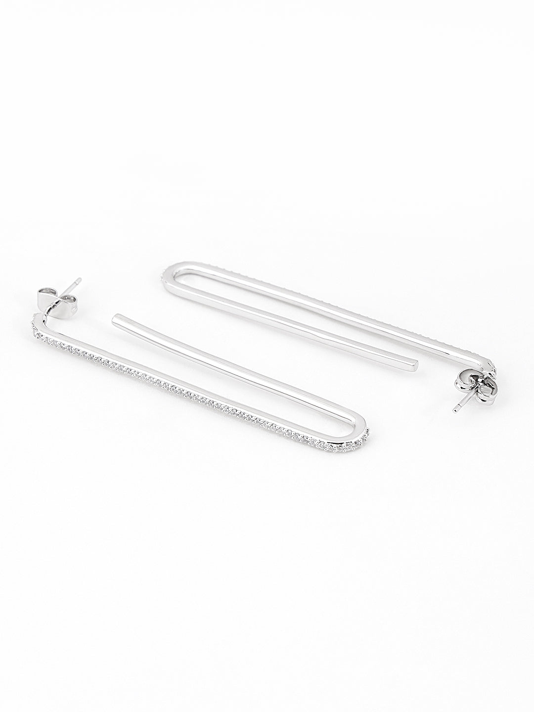 Close-up of sparkling silver stones on loop earrings