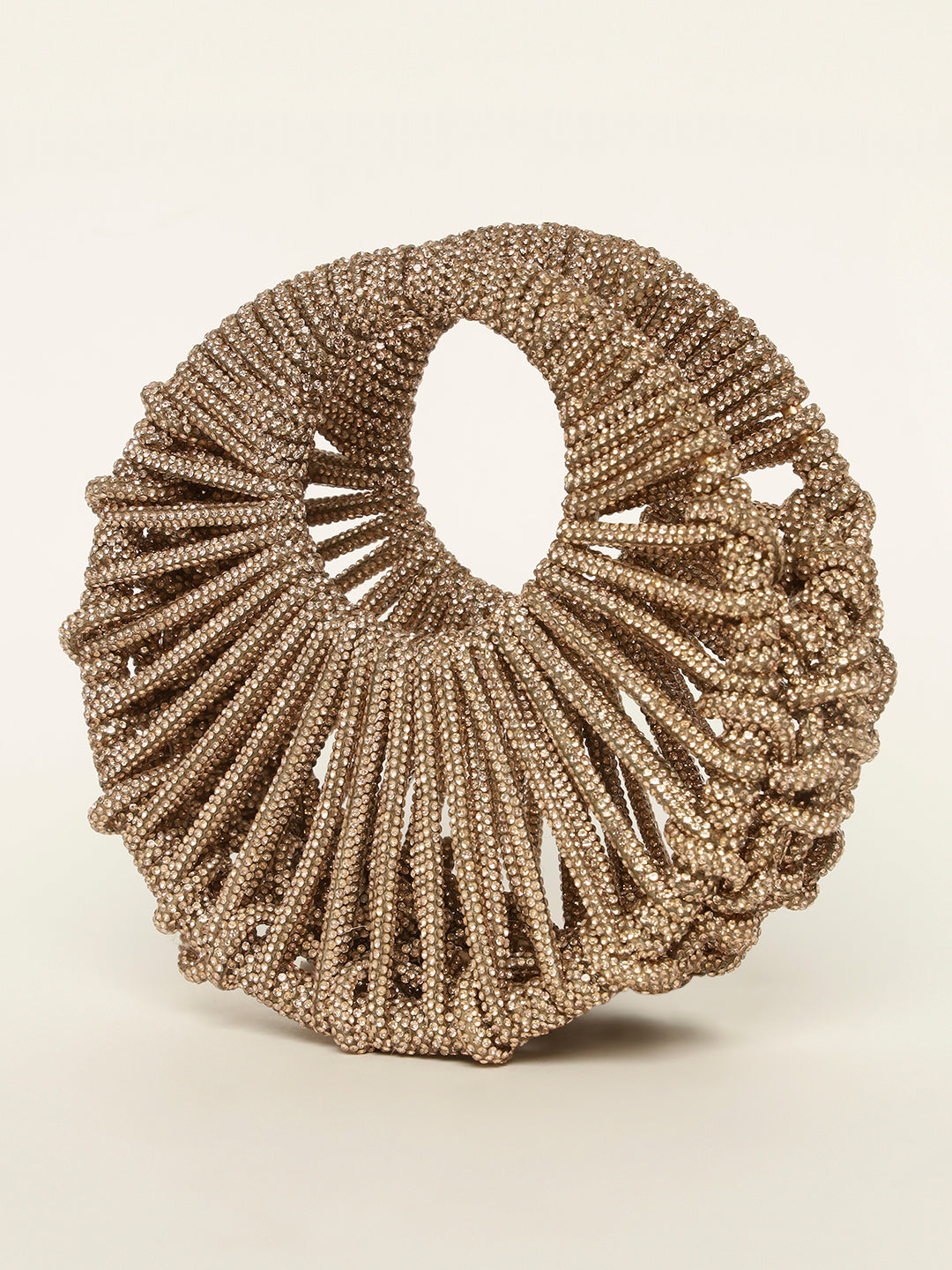 Close-up of crescent moon clutch in gold crystals