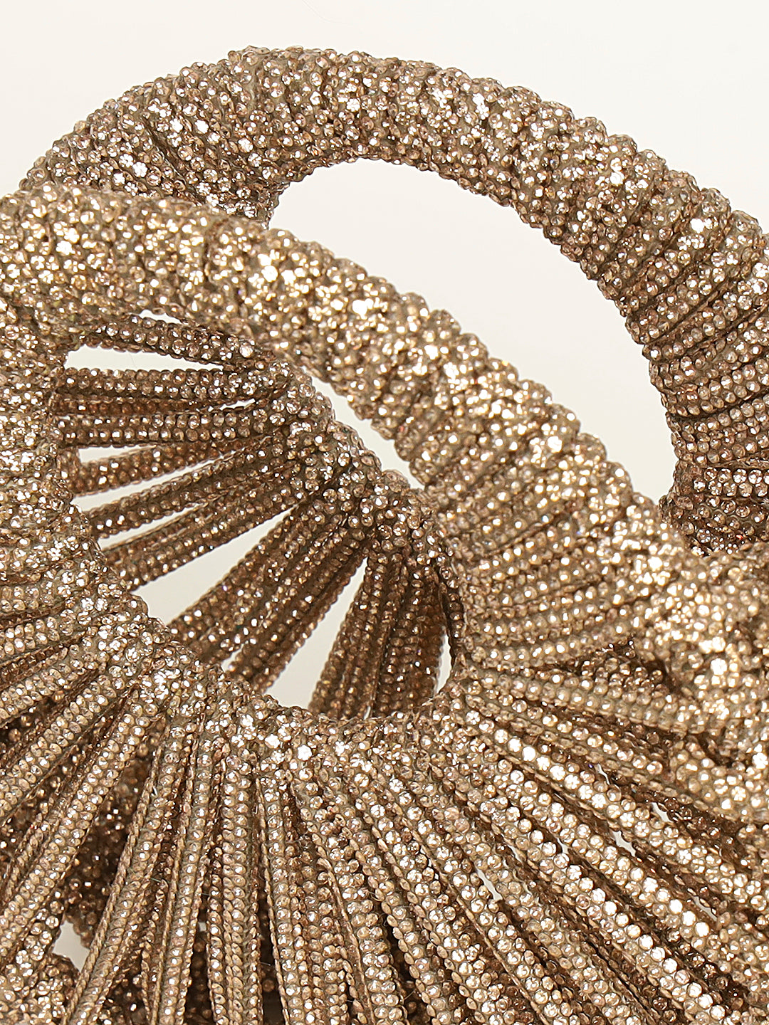 Crescent crystal clutch shining under soft lighting