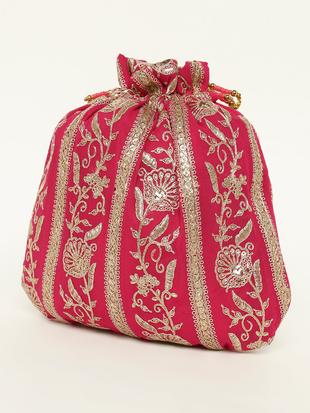 Pink and gold festive potli displayed for weddings