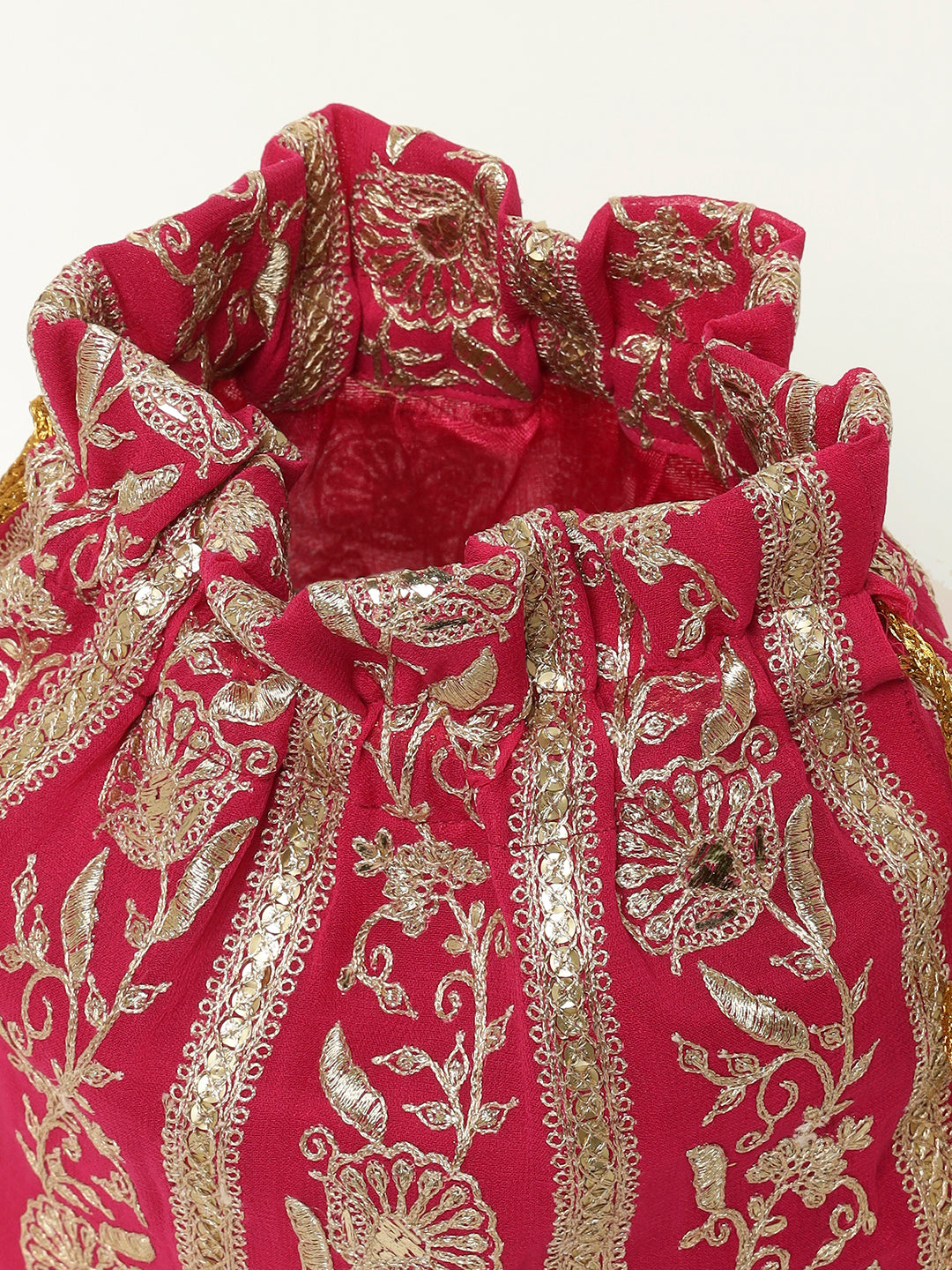 Elegant pink potli with traditional golden thread motif