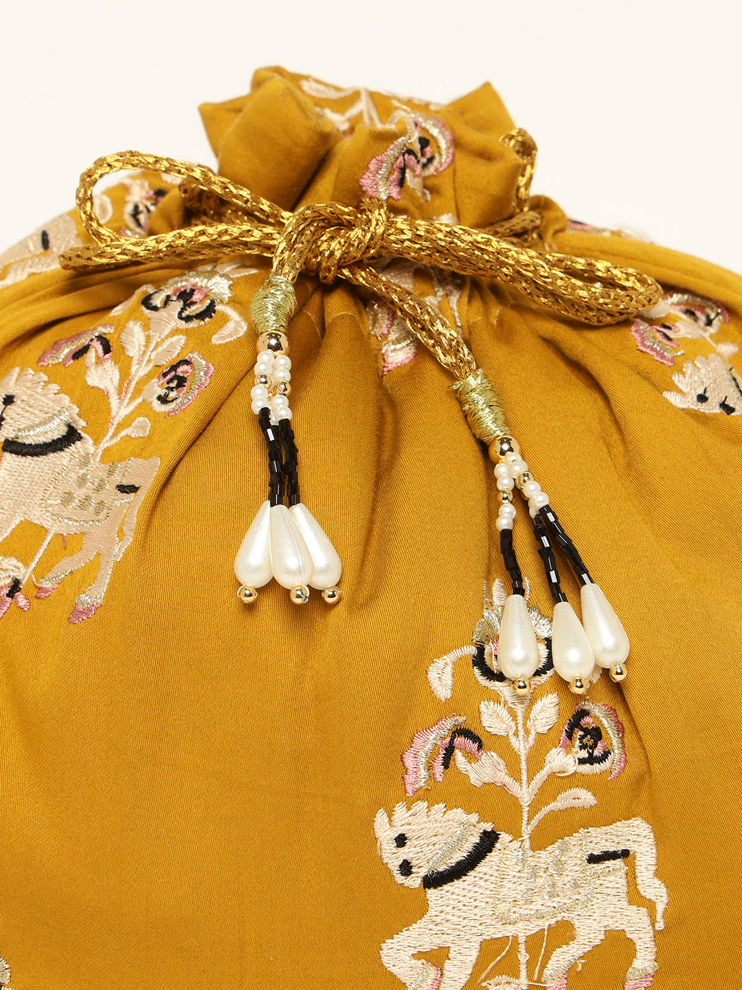 Close-up of horse embroidery on yellow potli bag