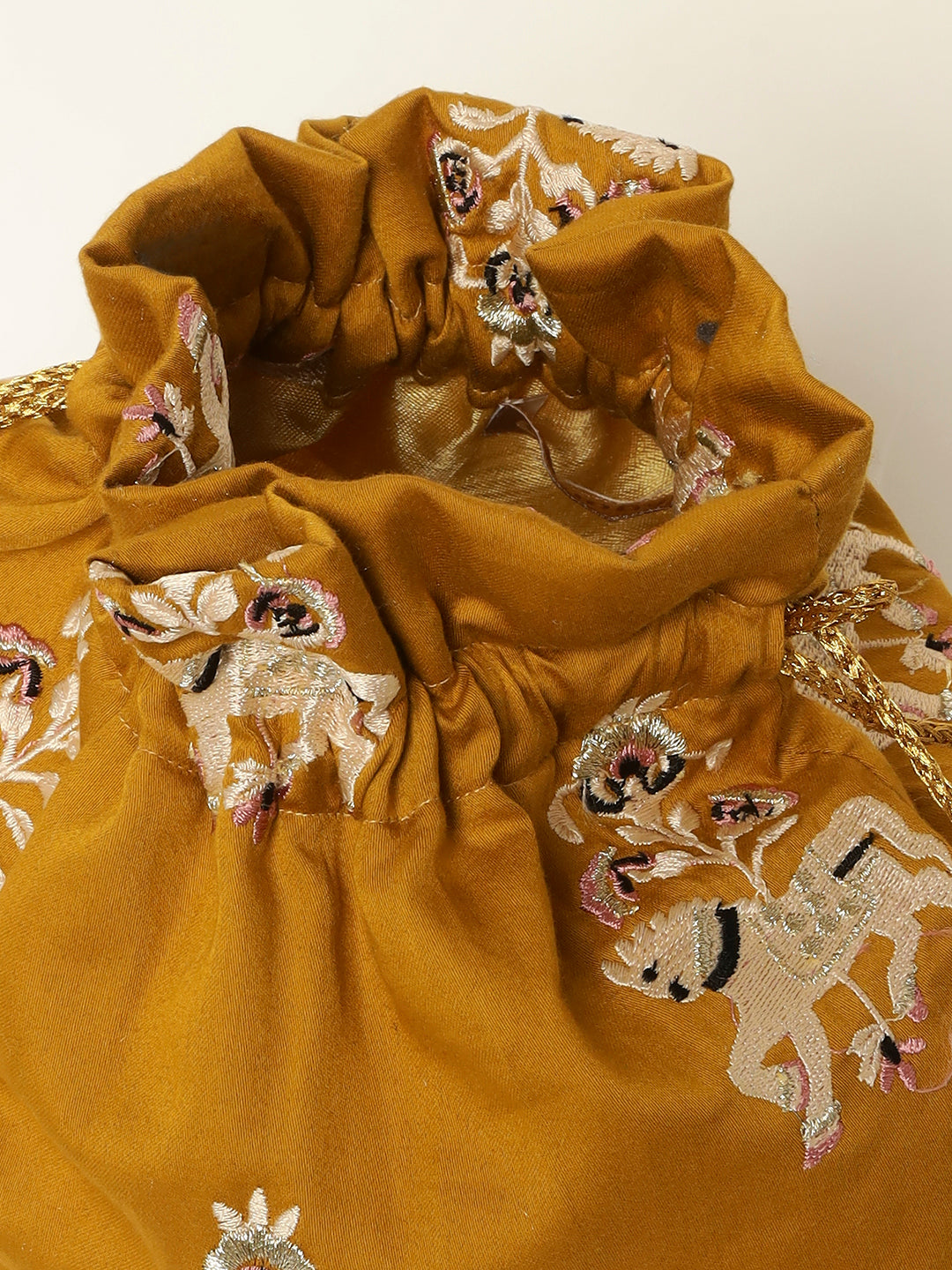 Wedding potli bag featuring elegant horse embroidery