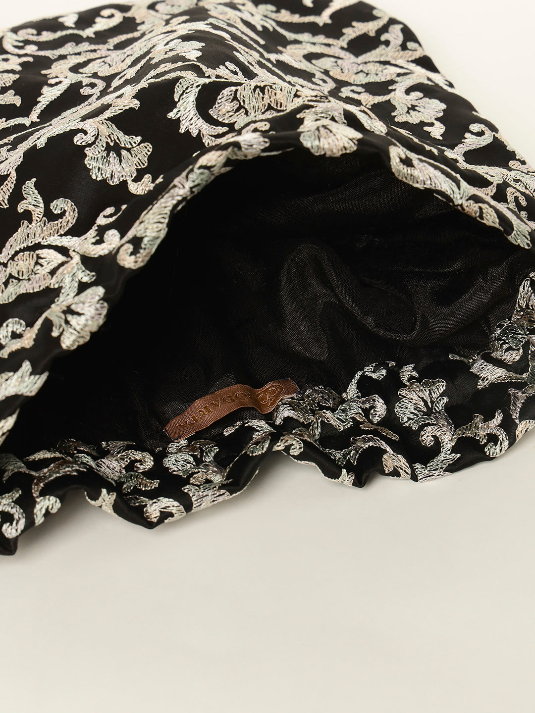 Festive black potli bag ideal for gifting occasions