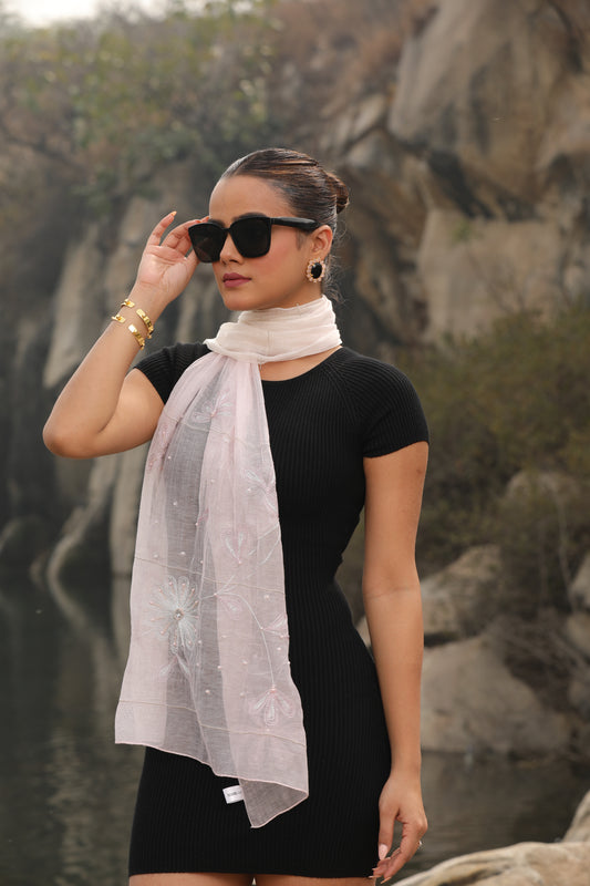 Modarta presents a chic pink scarf, delicately crafted with hand-embroidered floral patterns. Ideal for women seeking lightweight and versatile cotton scarves or stylish headscarves for everyday elegance.