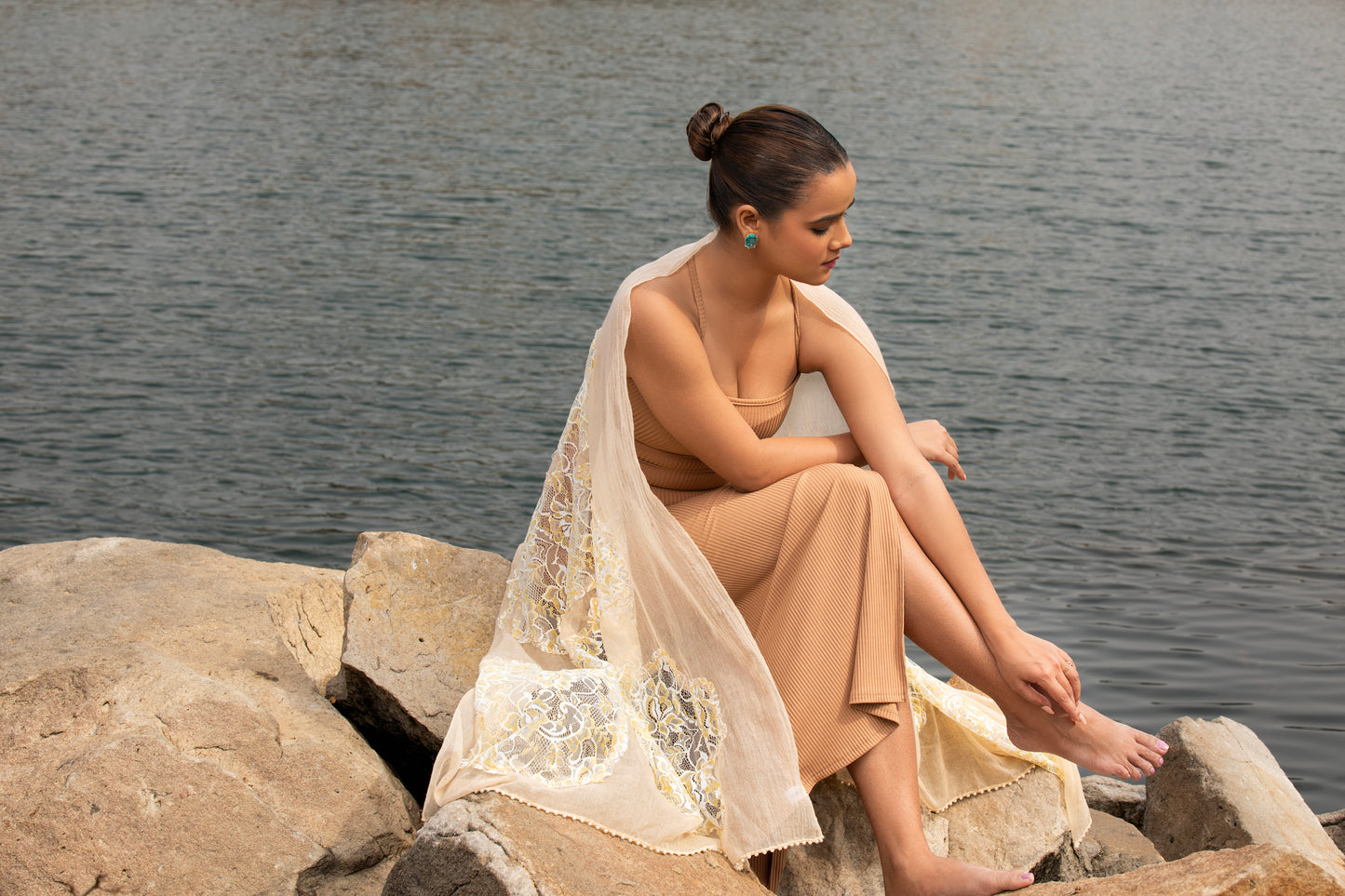 Indulge in luxury with our designer wool stole, a timeless accessory perfect for women seeking sophistication. Crafted with care, our beige scarf adds elegance to any ensemble with its exquisite silk blend and intricate design.