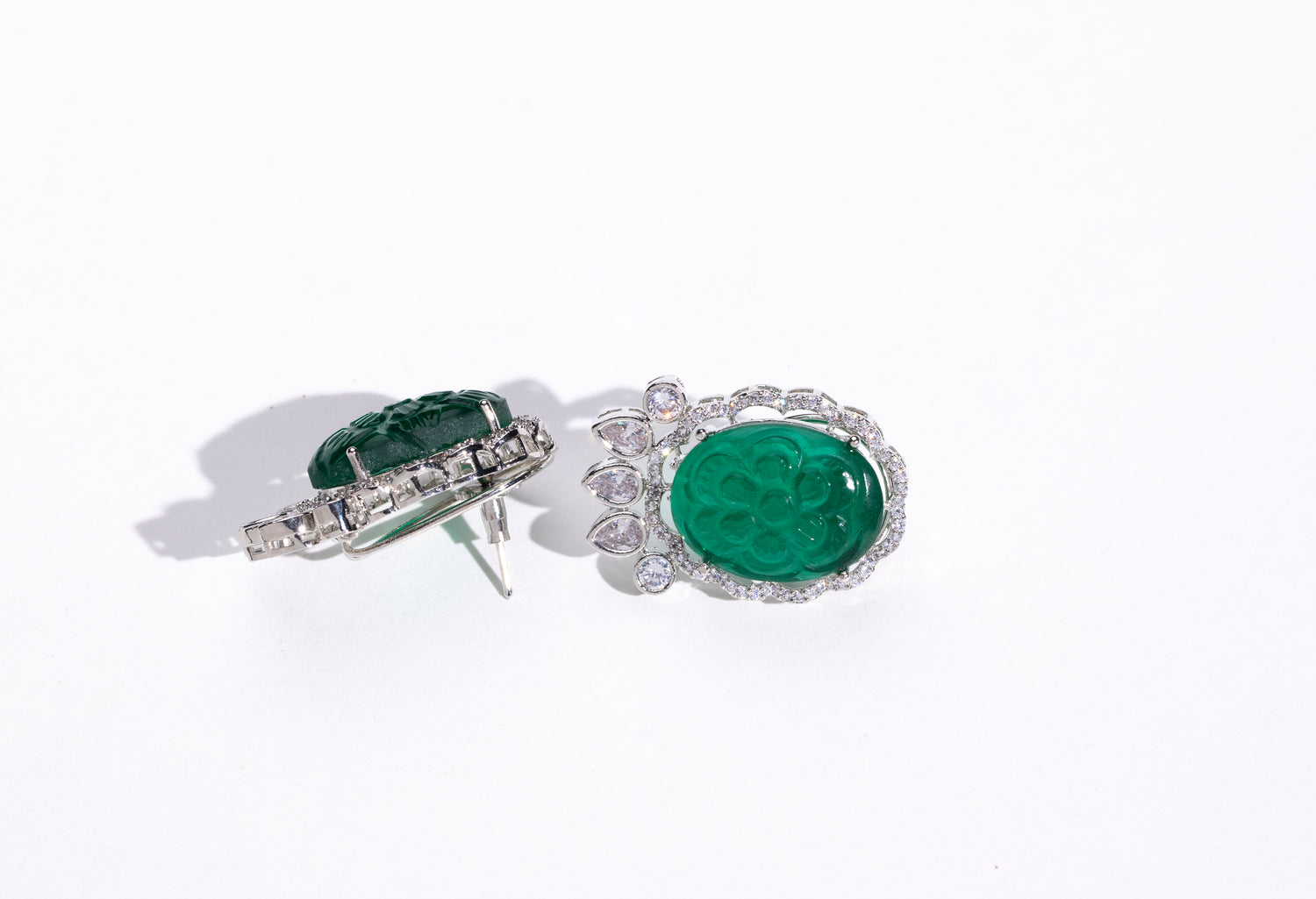 Investment in Jewelry: Classic Emerald Swarovski Earrings: Perfect for enhancing any outfit with their timeless design.