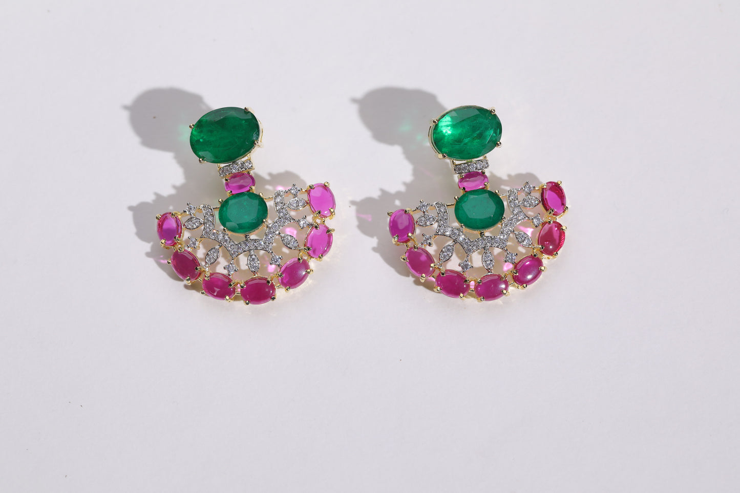 Versatile and Stylish Accessories: Add a touch of glamour to any outfit with our stunning earrings." "Fashion-Forward Earrings: Stand out from the crowd with our unique emerald and pink stone earrings