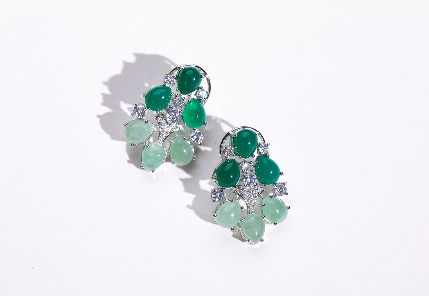 "Shop Now: Buy these stunning dual-tone green emerald earrings with Swarovski online