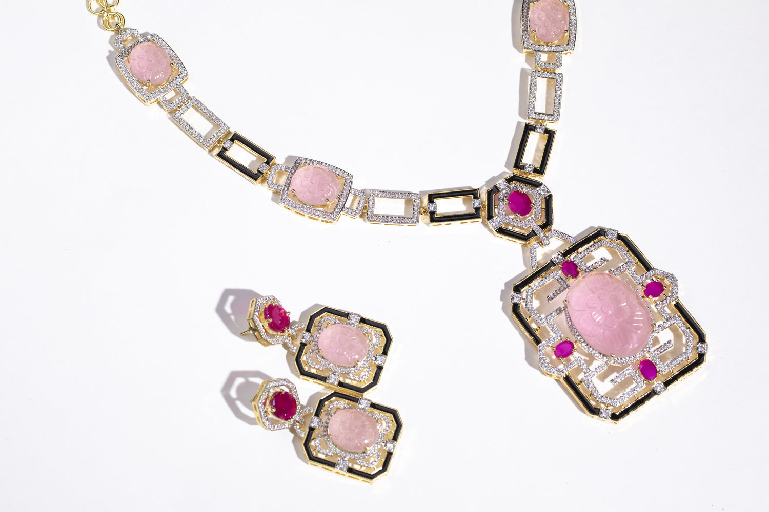Beautiful Pink Stone and Swarovski Jewelry Set: Complete your outfit with this modern and uber necklace set." "Unique Necklace Set: Stand out with this stunning pink stone and Swarovski detailing necklace set."