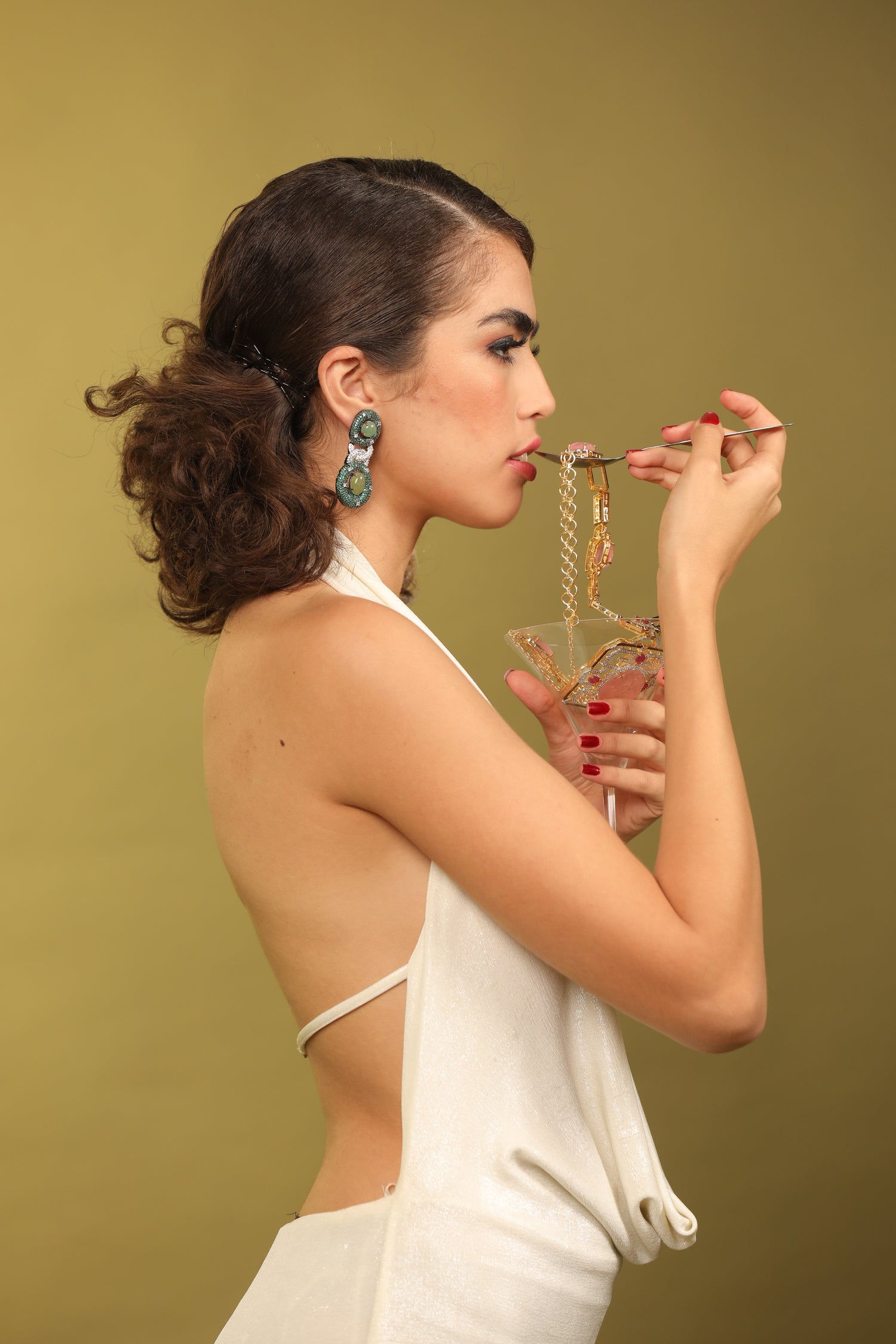 Fashionable Dangler Earrings: Elevate your look with these stylish earrings featuring emerald and Swarovski crystals.