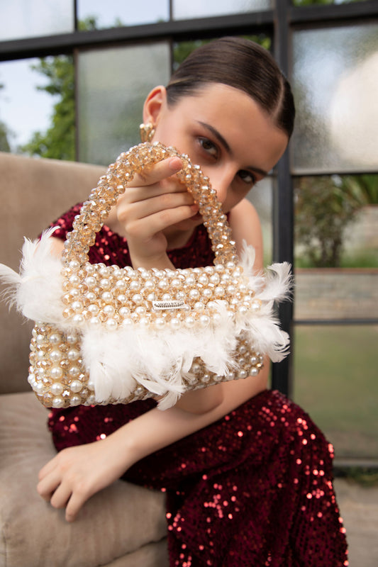 Pearl beaded bag decorated with feathers