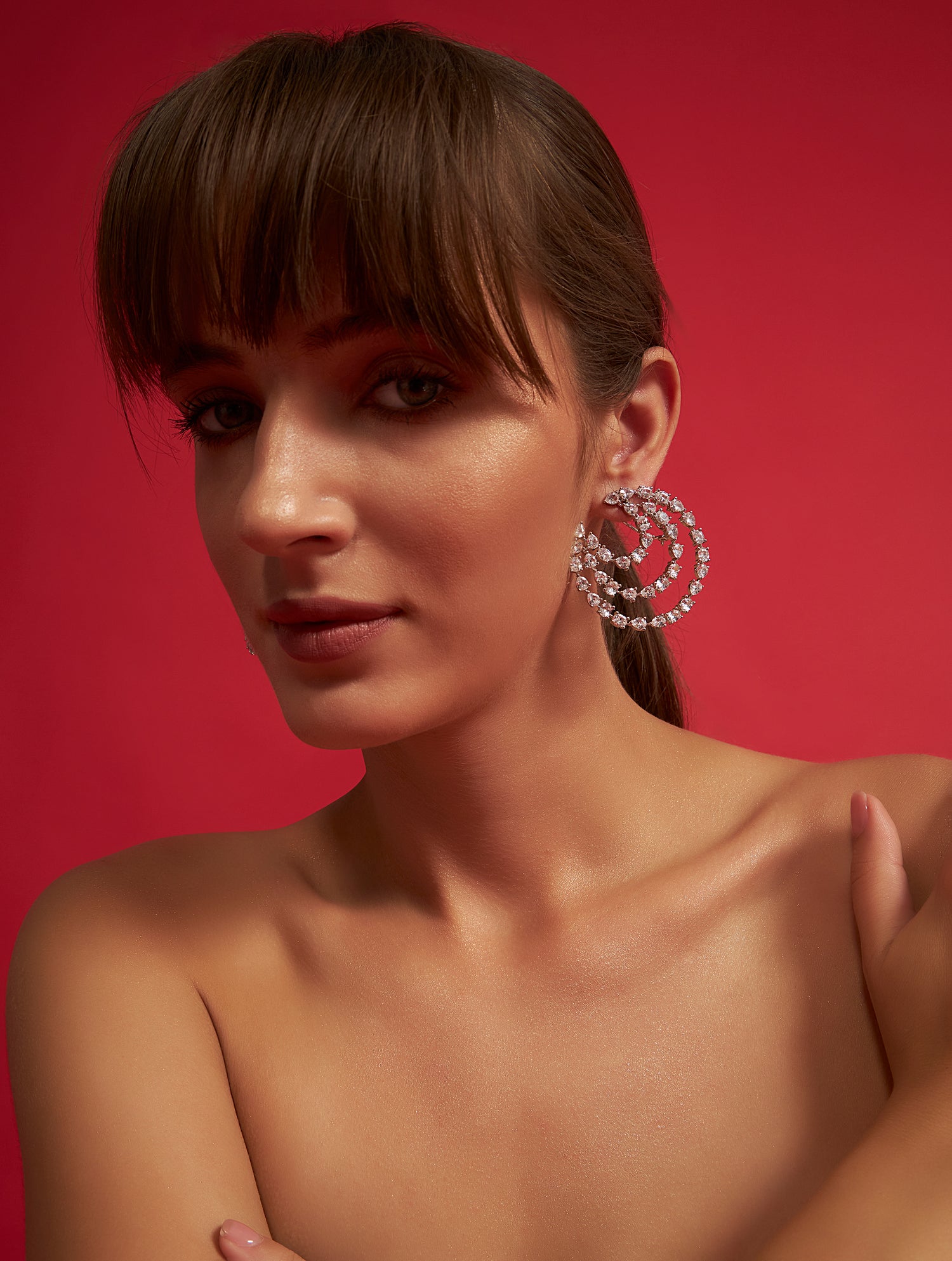 Designer spiral crystal solitaire earrings with statement styling