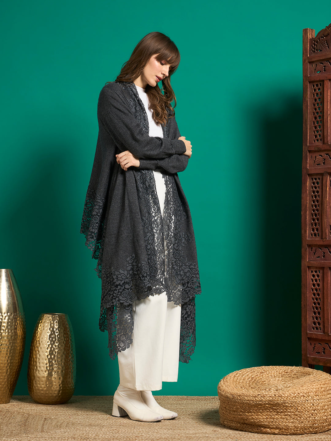 Grey long cape with sleeves and wide floral lace borders draping to a pointed handkerchief hem