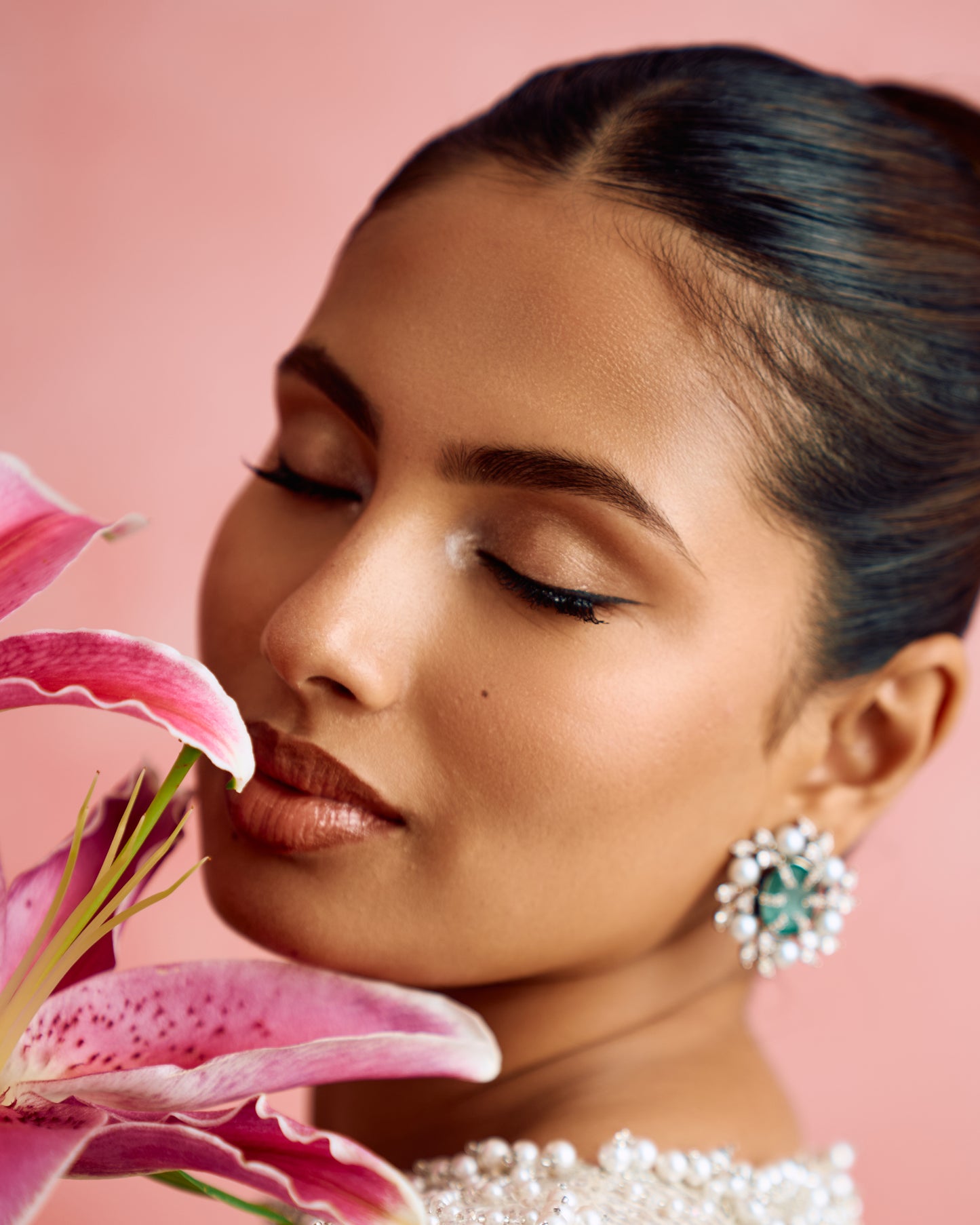 Aashna Hegde in an occasion look finished with Modarta green stone and pearl cluster earrings
